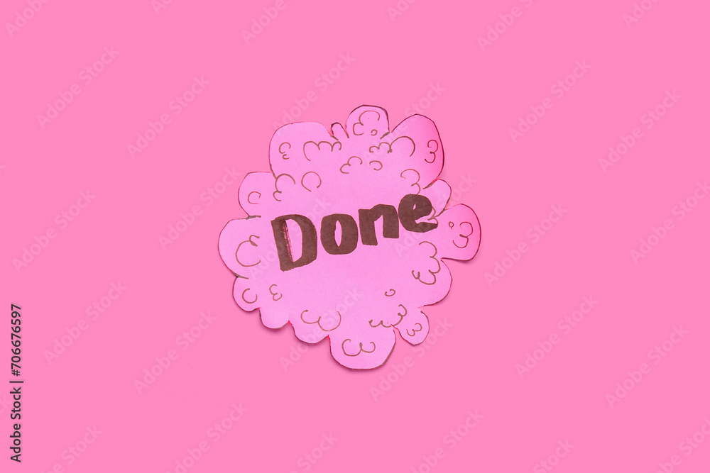 Sticky note with word DONE on pink background