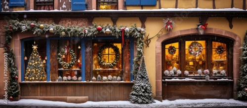 Christmas decorations adorning historic, traditional houses in Colmar, Alsace, France.