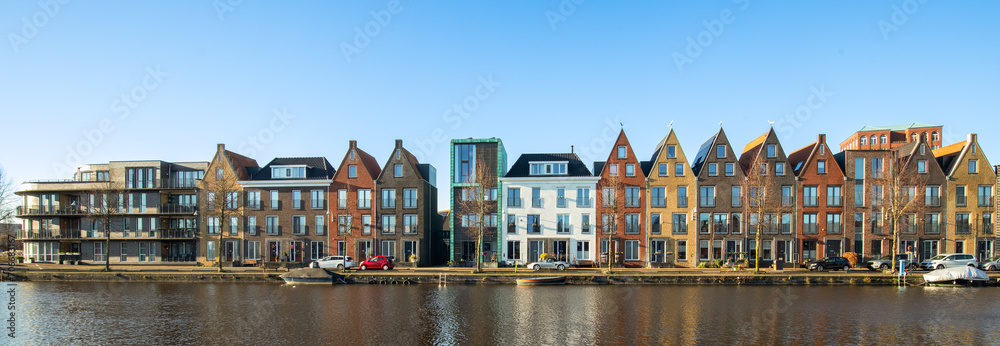 New modern colorful residential buildings along the water in the Vathorst district in Amersfoort.