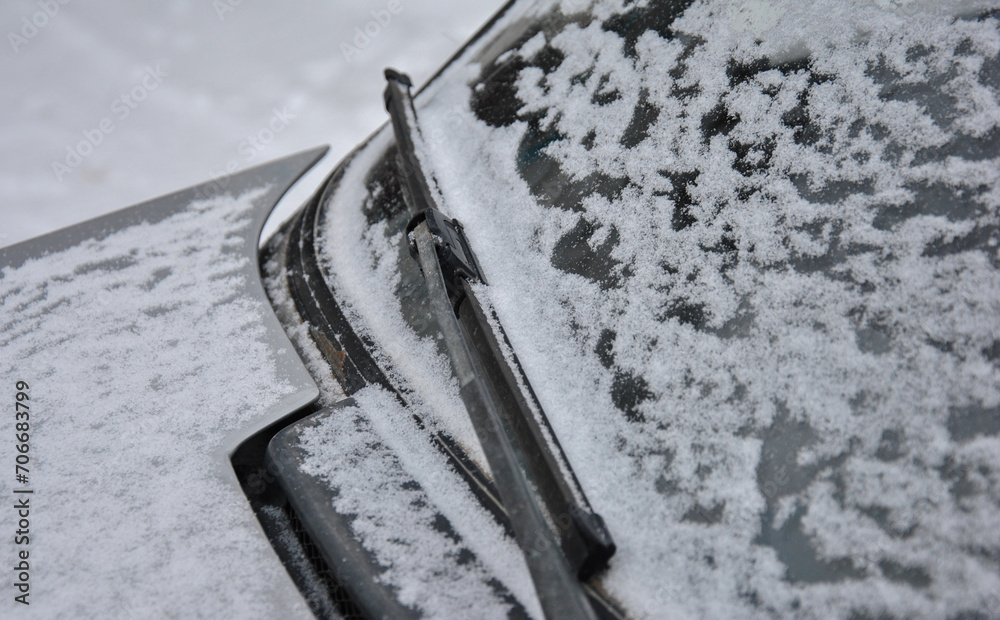 car wiper covered with snow.