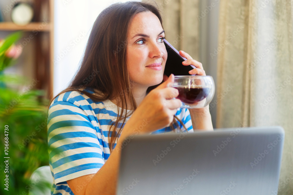 Woman Multitasking with Coffee and Smartphone at Home Woman Multitasking with Coffee and Smartphone at Home