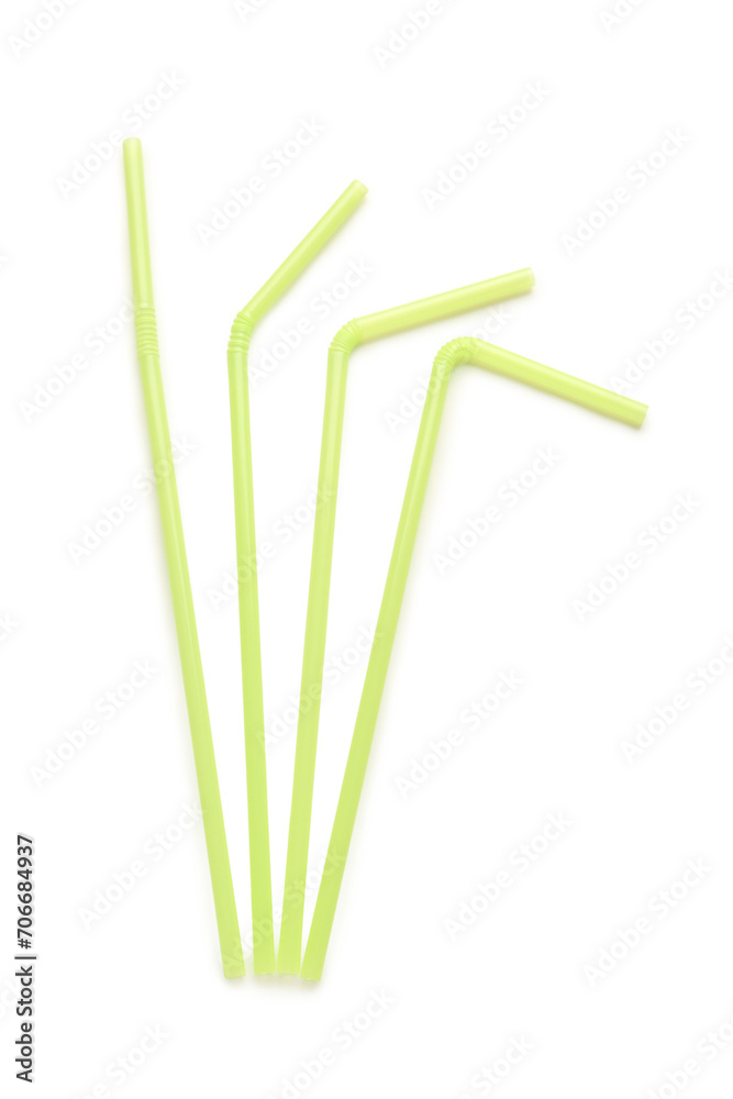 Green plastic straws on white background Green plastic straws on white background