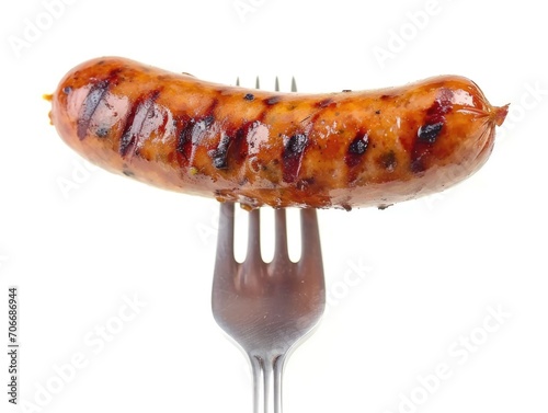 Grilled Sausage on a Fork on white background 