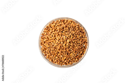 Raw buckwheat in a bowl isolated on a white background. Wheat grains, porridge, cereals, raw buckwheat in a plate. Healthy food. Porridge. Diet. Organic cerea