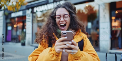 woman looks at phone and smiles Generative AI