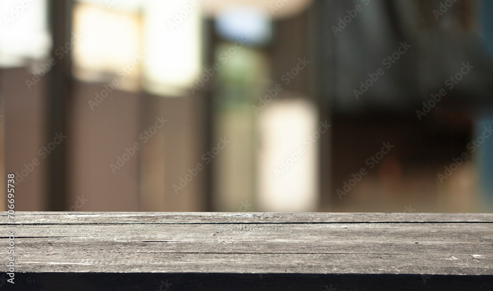 Empty dark wooden table in front of restaurant abstract blurred bokeh background. can be used to demonstrate or mount your products. Layout for space Empty dark wooden table in front of restaurant abstract blurred bokeh background. can be used to demonstrate or mount your products. Layout for space