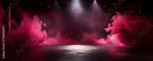 The dark stage shows  empty crimson  maroon  burgundy background  neon light  spotlights  The asphalt floor and studio room with smoke