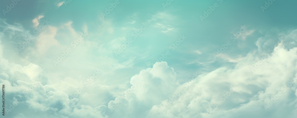Teal sky with white cloud background