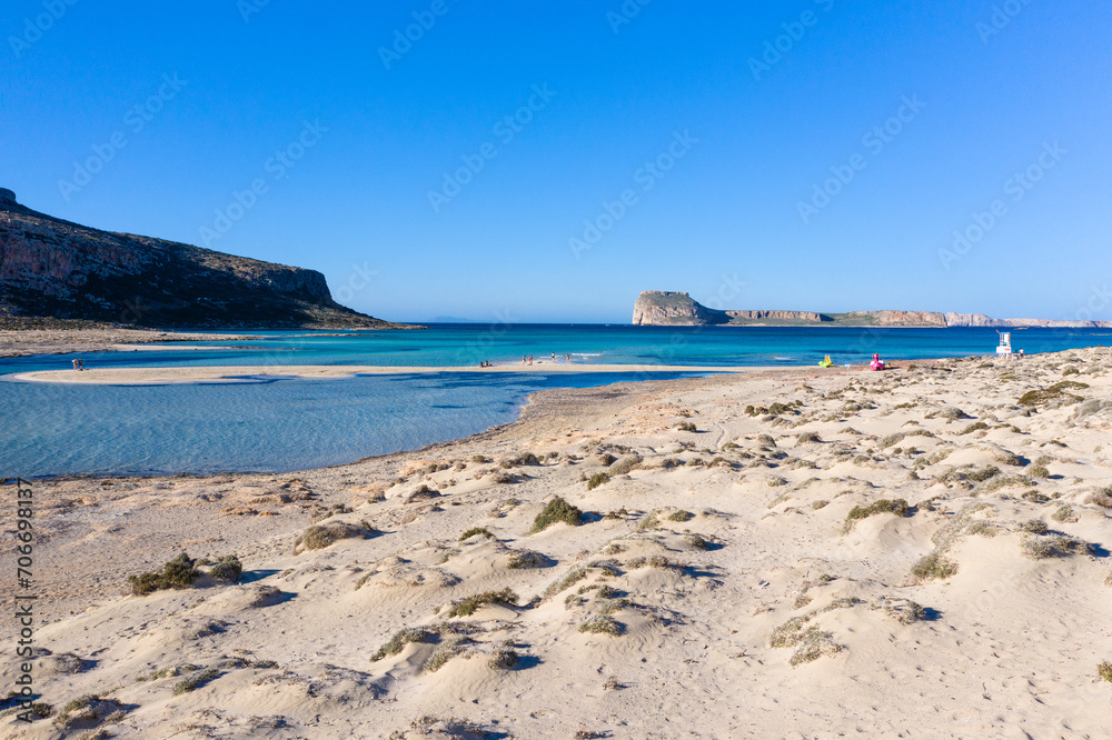 Amazing view of Balos Lagoon with magical turquoise waters, lagoons, tropical beaches of pure white sand and Gramvousa island on Crete, Greece