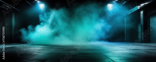 The dark stage shows  empty turquoise  aquamarine  teal background  neon light  spotlights  The asphalt floor and studio room with smoke
