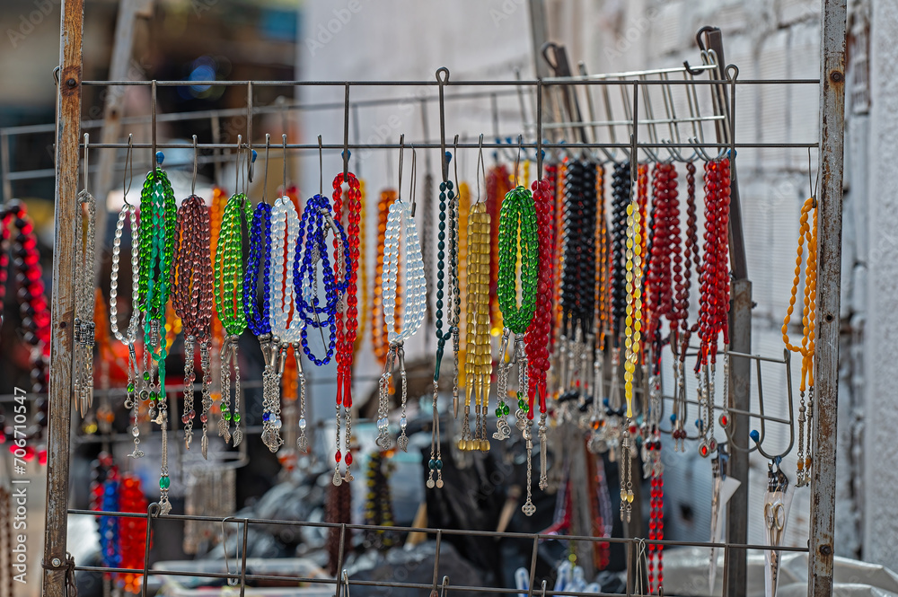 Colourful rosaries on the street vendor's stall.