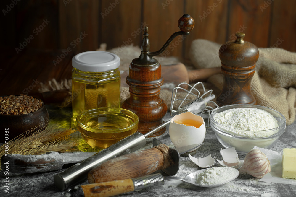 Kneading dough with flour and eggs, on an old background Kneading dough with flour and eggs, on an old background