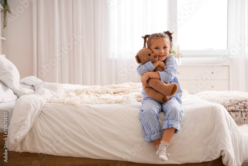 Cute little girl with toy b...