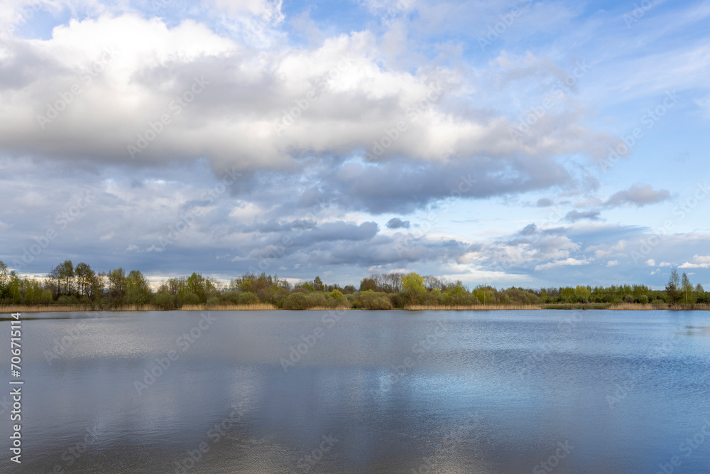 landscape with clouds reflected in the water. Spring landscape