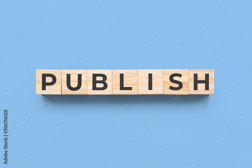publish wooden cubes on blue background