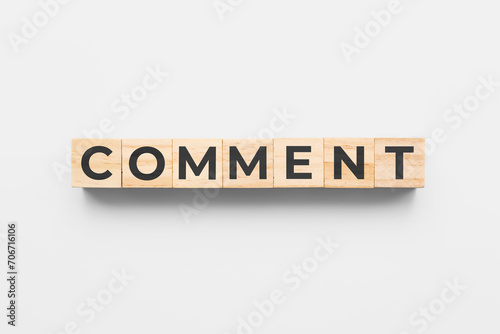 comment wooden cubes on white background