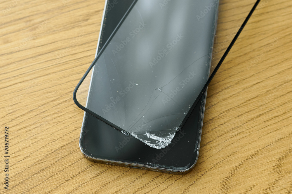 The protective glass for the screen protects the phone from cracks and scratches in the event of a fall. The concept of repairing gadgets and installing protective glass The protective glass for the screen protects the phone from cracks and scratches in the event of a fall. The concept of repairing gadgets and installing protective glass