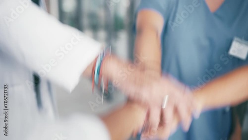 Doctor, meeting and hands together in teamwork for collaboration, motivation or unity at hospital. Closeup of medical group or team piling in cheering, coordination or support together at clinic photo