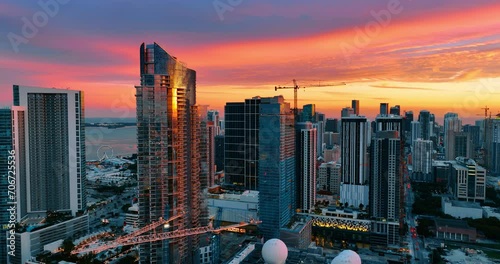 Awesome view of Miami Beach architecture in the light of setting sun. Adorable pink and purple sky under the modern skyscrapers in the city downtown. Top view. photo