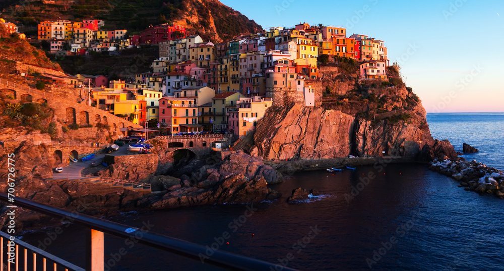 View of colorful town of Manarola on cliffs above Ligurian Sea, Italy