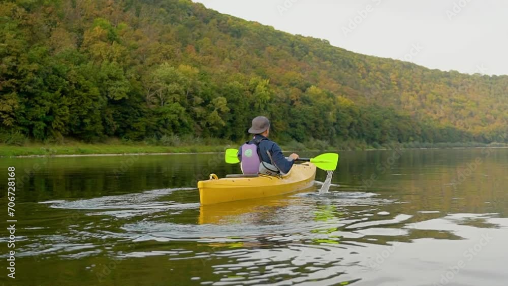 Rafter swims in a kayak on the river Rafter swims in a kayak on the river