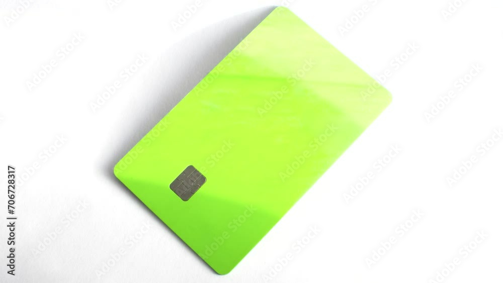 Credit card on a white surface, a symbol of financial possibilities in a clean setting. Credit card on a white surface, representing purchasing power in a minimalist environment. Credit card on a white surface, a symbol of financial possibilities in a clean setting. Credit card on a white surface, representing purchasing power in a minimalist environment.