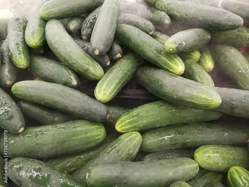 Pile of fresh cucumbers in the supermarket.