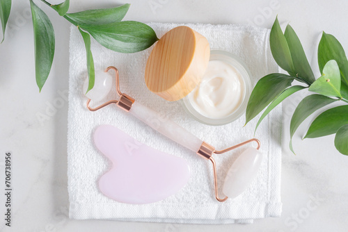 Luxury skincare products with jade roller and gua sha photo