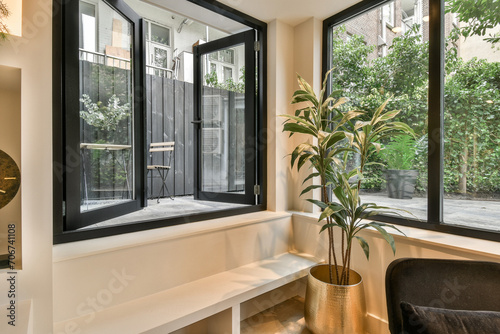 a window seat with a potted plant on it photo