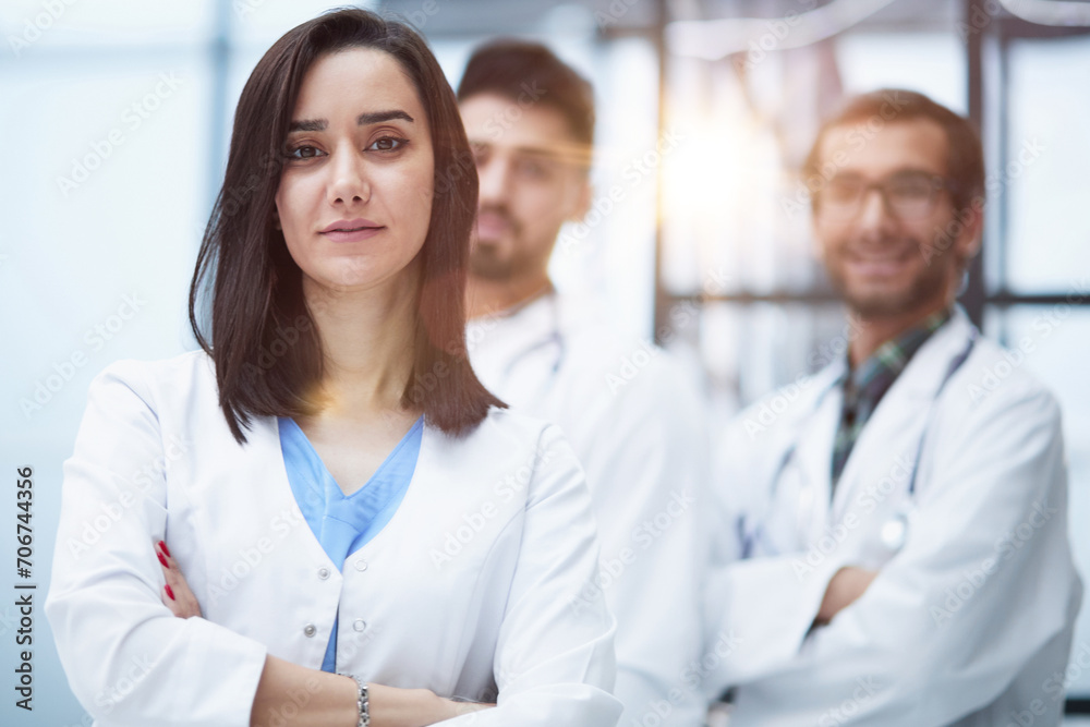 Attractive female doctor in front of medical stuff in hospital Attractive female doctor in front of medical stuff in hospital