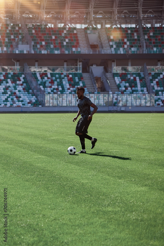 Professional football player in action at the stadium. Professional football player in action at the stadium.