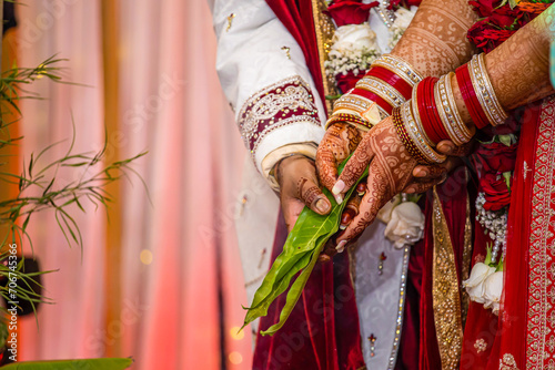 Indian Hindu wedding ceremony ritual items and hands close up © Stella Kou