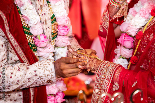 Indian Hindu wedding ceremony ritual items and hands close up © Stella Kou