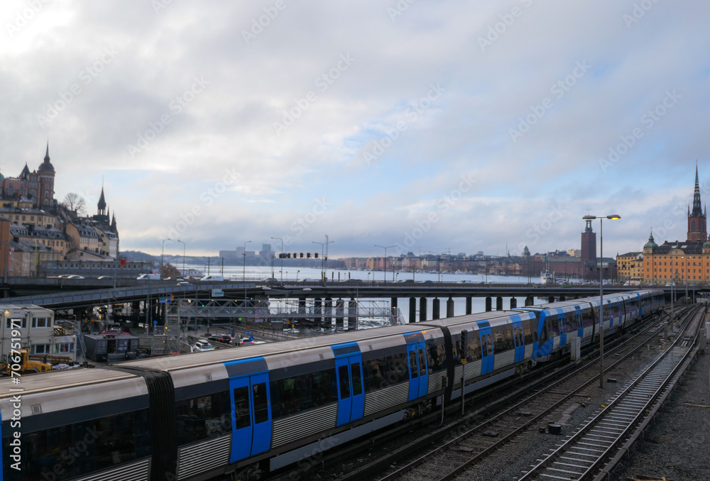 Fototapeta premium High angle view of a train crossing a bridge in the city