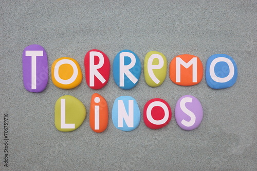 Torremolinos, municipality in Andalusia, southern Spain, west of Malaga, souvenir composed with hand painted multi colored stone letters over green sand