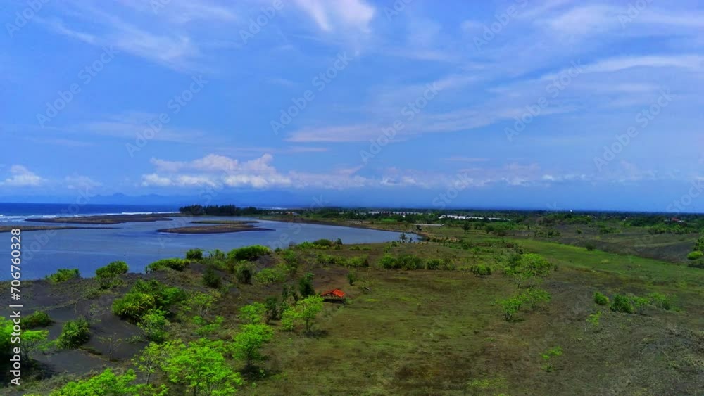 A long winding coastal road, in JLS or south coast line road in Jember, Indonesia with the view of ocean. A long winding coastal road, in JLS or south coast line road in Jember, Indonesia with the view of ocean.