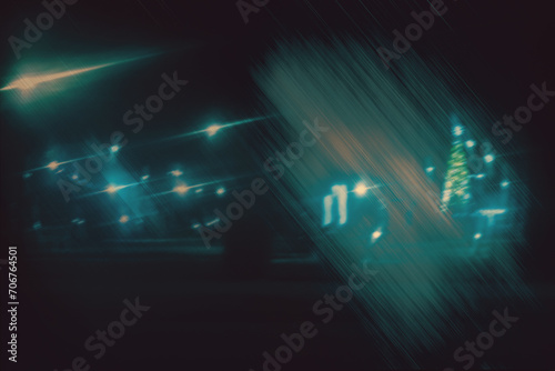Bright lights of the night city, view of the park alley through the car glass through the refraction of light and fog