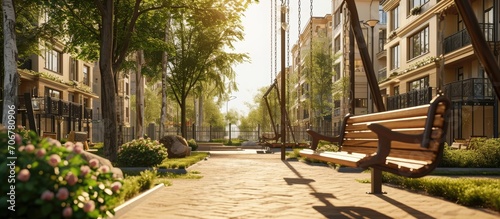 Street swings hang in the courtyard of the house a children s playground on the street wooden swings on chains a residential quarter a place of rest for citizens High quality photo
