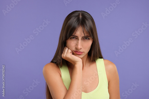 Wallpaper Mural Portrait of resentful woman on violet background Torontodigital.ca