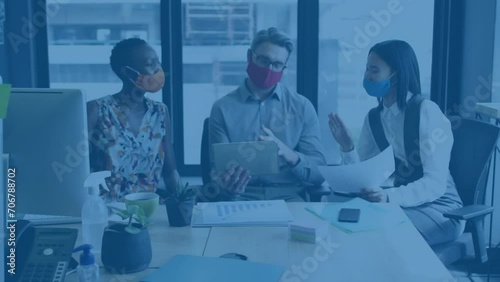 Animation of data processing over diverse business people in facer masks at meeting