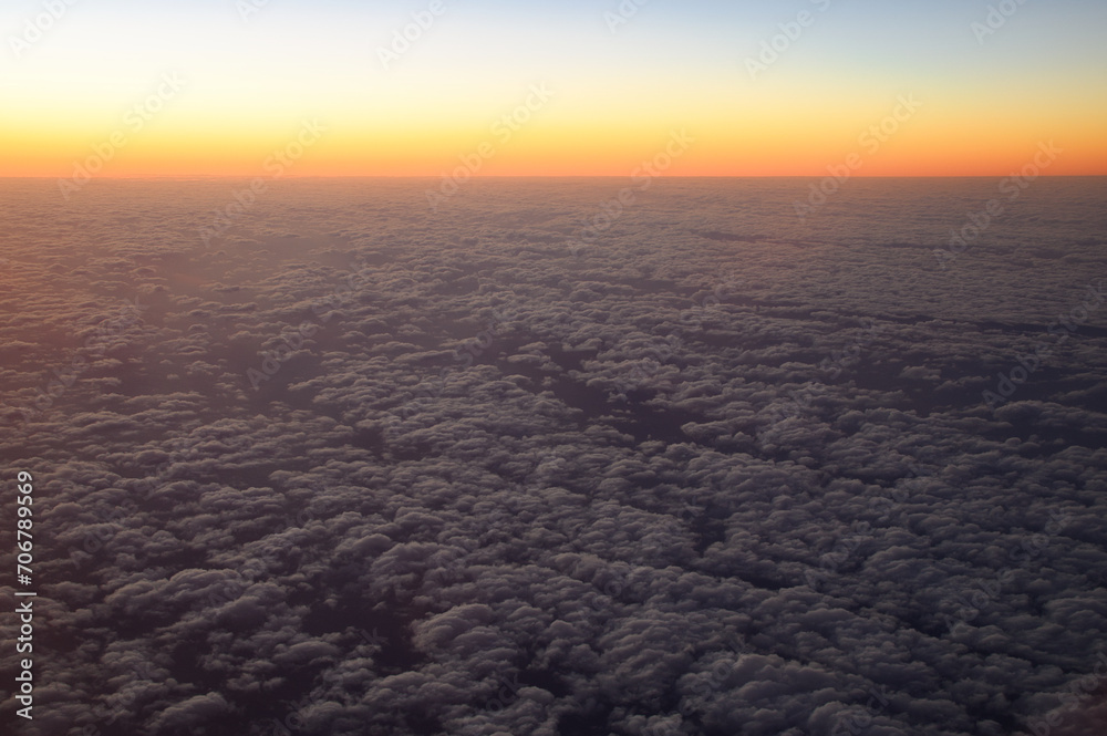 sunrise over the sea from airplane