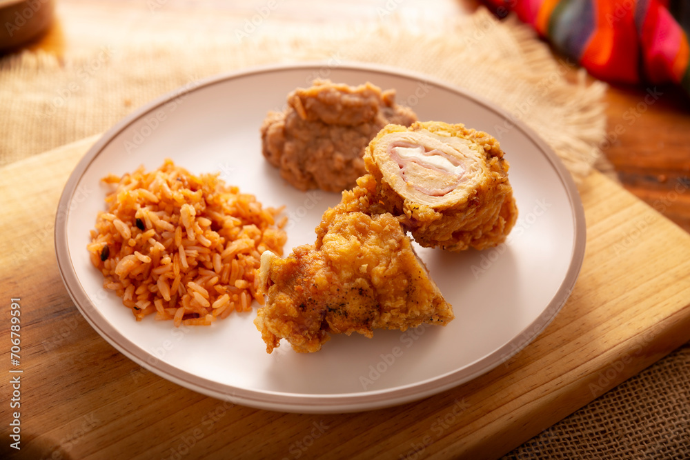 Chicken Cordon Bleu. Chicken breast meat wrapped with ham and cheese, breaded and fried or baked. Also known as schnitzel cordon bleu, a very popular recipe in many countries. Chicken Cordon Bleu. Chicken breast meat wrapped with ham and cheese, breaded and fried or baked. Also known as schnitzel cordon bleu, a very popular recipe in many countries.