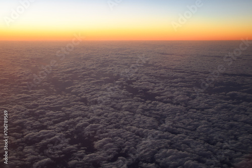 sunrise over the sea from airplane