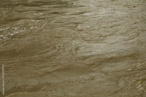 Obraz na plátně Muddy water from a high flow river