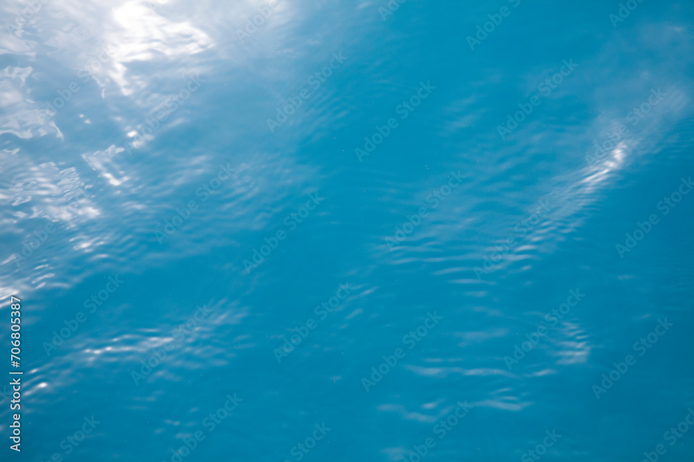 Clear blue tropical ocean surface background with sunlight reflection, Palau