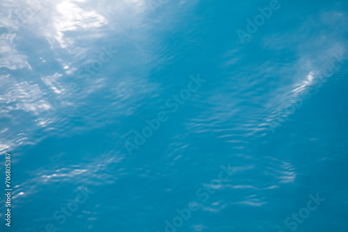 Clear blue tropical ocean surface background with sunlight reflection, Palau