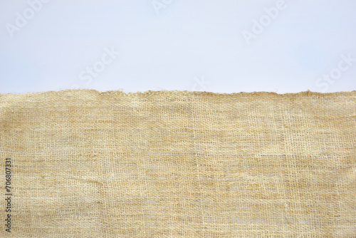 torn sackcloth isolated on white background, burlap fabric texture for design photo
