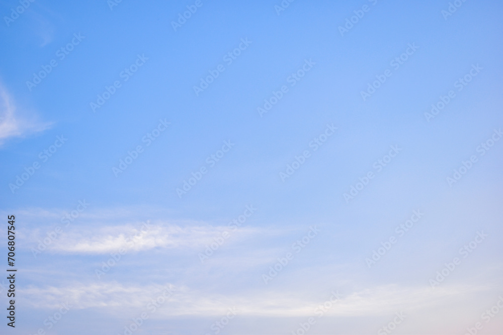 beautiful blue sky and white fluffy cloud with sunrise in the morning, natural background