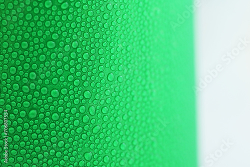 water drop on green beverage cans background  texture of cold aluminium drink package