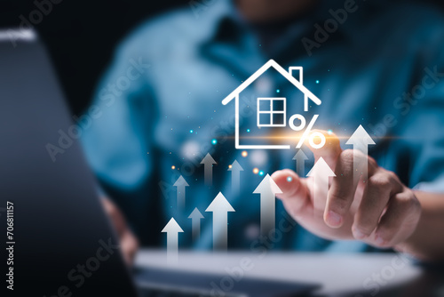 Real estate investment concept. Man touch virtual house icon for analyzing mortgage loan home and insurance real property mortgage. interest rate, Investment planning, business real estate. photo